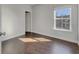 Sunlit bedroom features hardwood floors and a large window at 253 Palmetto Walk Dr, Summerville, SC 29486