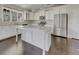 Well-appointed kitchen features a center island, granite countertops, and stainless steel appliances at 253 Palmetto Walk Dr, Summerville, SC 29486