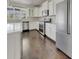 Bright kitchen featuring stainless steel appliances, granite counters, and white cabinets at 253 Palmetto Walk Dr, Summerville, SC 29486