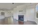 Hardwood floors highlight the fireplace focal point in this bright and welcoming living room at 253 Palmetto Walk Dr, Summerville, SC 29486