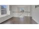Well-lit loft space with hardwood floors, window bench, built-ins and staircase at 253 Palmetto Walk Dr, Summerville, SC 29486