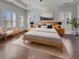 A primary bedroom features a wooden bed frame with matching dressers and soft decor at 253 Palmetto Walk Dr, Summerville, SC 29486