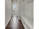 A modern mudroom with coat hooks, bench seating, and storage cubbies at 253 Palmetto Walk Dr, Summerville, SC 29486