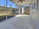 Covered patio with views of the backyard, exterior shed, and natural wooded area at 253 Palmetto Walk Dr, Summerville, SC 29486