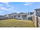 Grassy backyard with screened porch, fenced in for privacy at 259 N Light Way, Summerville, SC 29486