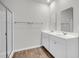 Bathroom showcasing a shower with glass door and double sink vanity at 259 N Light Way, Summerville, SC 29486