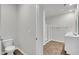 Bathroom featuring a toilet, frameless glass shower, and double sink vanity at 259 N Light Way, Summerville, SC 29486
