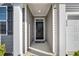 Inviting home entrance with a covered porch and modern gray finishes at 259 N Light Way, Summerville, SC 29486