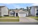 Charming single-Gathering home with gray siding, a two-car garage, and a well-manicured lawn at 259 N Light Way, Summerville, SC 29486