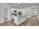 Contemporary kitchen with white cabinets, granite countertops, stainless appliances, and an island at 259 N Light Way, Summerville, SC 29486