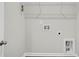 The laundry room has a utility sink, open shelving, and white walls at 259 N Light Way, Summerville, SC 29486