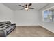 Living room featuring hard surface flooring, a ceiling fan, and a window at 259 N Light Way, Summerville, SC 29486