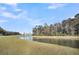 The back of the yard offers a beautiful pond at 259 N Light Way, Summerville, SC 29486
