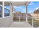 Screened porch view of fenced yard and blue sky at 259 N Light Way, Summerville, SC 29486