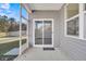 A view of sliding glass door and windows from screened porch at 259 N Light Way, Summerville, SC 29486