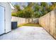 Private backyard with a concrete patio and wooden fence at 270 Stefan Dr # 11-C, Charleston, SC 29412