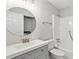 Bathroom with a vanity, round mirror, and a tub with shower at 270 Stefan Dr # 11-C, Charleston, SC 29412