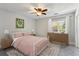 Bedroom featuring a ceiling fan, rug, bed, and matching nightstands at 270 Stefan Dr # 11-C, Charleston, SC 29412
