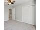 Spacious bedroom with a ceiling fan, carpet, and a double door closet for storage at 270 Stefan Dr # 11-C, Charleston, SC 29412