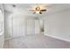 Bright bedroom featuring carpeted floors, ceiling fan, and closet at 270 Stefan Dr # 11-C, Charleston, SC 29412