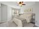 Light-filled bedroom featuring a ceiling fan, artwork, neutral paint, and a large window at 270 Stefan Dr # 11-C, Charleston, SC 29412