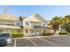A charming two-story condo with pale yellow siding, well-kept landscaping, and convenient parking at 270 Stefan Dr # 11-C, Charleston, SC 29412