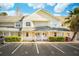 Inviting townhouse with charming front porch, green landscaping, and designated parking at 270 Stefan Dr # 11-C, Charleston, SC 29412