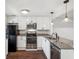 Stylish kitchen featuring stainless steel appliances, granite counters, and white cabinetry at 270 Stefan Dr # 11-C, Charleston, SC 29412