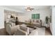 Bright living room with hardwood floors, comfortable seating, and a view into the modern kitchen at 270 Stefan Dr # 11-C, Charleston, SC 29412