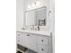 Bright bathroom with a white vanity, marble countertop, modern fixtures, and a large mirror at 2912 Yachtsman Dr, Mount Pleasant, SC 29466