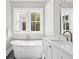 Bathroom featuring a freestanding tub, marble countertop, and designer fixtures at 2912 Yachtsman Dr, Mount Pleasant, SC 29466