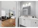 Bathroom featuring a white vanity with countertop space, and an open doorway that leads to a bright bedroom at 2912 Yachtsman Dr, Mount Pleasant, SC 29466