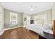 Bright bedroom features hardwood floors, a ceiling fan, and plenty of natural light at 2912 Yachtsman Dr, Mount Pleasant, SC 29466