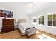 Bright bedroom with white walls, hardwood floors, and large windows, offering a serene and inviting atmosphere at 2912 Yachtsman Dr, Mount Pleasant, SC 29466