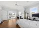 Bright bedroom features hardwood floors, ceiling fan, ensuite access to deck, and dedicated desk space at 2912 Yachtsman Dr, Mount Pleasant, SC 29466