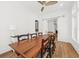 Dining room with hardwood floors, ceiling fan, long wooden table and seating for eight at 2912 Yachtsman Dr, Mount Pleasant, SC 29466