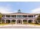 Grand two-story brick home featuring a circular driveway and an upper porch at 2912 Yachtsman Dr, Mount Pleasant, SC 29466