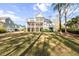 Stately home featuring multiple balconies, a well-manicured lawn, and ample space for outdoor enjoyment at 2912 Yachtsman Dr, Mount Pleasant, SC 29466