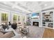 Spacious living room with fireplace, built-in shelving, and abundant natural light at 2912 Yachtsman Dr, Mount Pleasant, SC 29466