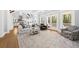 Open living room features a fireplace, coffered ceiling, and access to the backyard deck at 2912 Yachtsman Dr, Mount Pleasant, SC 29466