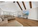 Bright living room featuring vaulted ceilings with exposed wood beams, hardwood floors, and comfortable seating at 2912 Yachtsman Dr, Mount Pleasant, SC 29466