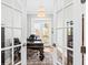 Bright office with hardwood floors, French doors to patio and decorative ceiling light at 2912 Yachtsman Dr, Mount Pleasant, SC 29466