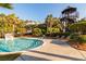 Inviting swimming pool with a water slide, surrounded by lush greenery and lounge chairs at 2912 Yachtsman Dr, Mount Pleasant, SC 29466