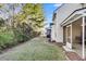 A well maintained backyard with a screened-in porch and lush greenery provides a private outdoor space at 303 Pine Bluff Dr, Summerville, SC 29483