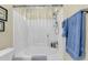 Bathroom featuring a shower and tub, white tile surround, and neutral paint at 303 Pine Bluff Dr, Summerville, SC 29483