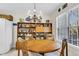 Bright dining area featuring a round wooden table with four chairs and built-in shelving at 303 Pine Bluff Dr, Summerville, SC 29483