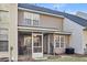 Back exterior of house featuring a screened in patio, multiple windows, and an air conditioning unit at 303 Pine Bluff Dr, Summerville, SC 29483