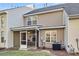 Back exterior of house featuring a screened in patio, multiple windows, and an air conditioning unit at 303 Pine Bluff Dr, Summerville, SC 29483