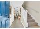 Inviting foyer featuring tile floors, staircase, and an open view into the home's living space at 303 Pine Bluff Dr, Summerville, SC 29483
