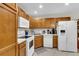 Functional kitchen with white appliances, plenty of cabinet space, and laminate countertops at 303 Pine Bluff Dr, Summerville, SC 29483